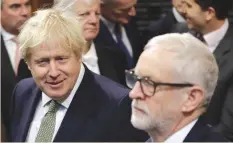  ?? (Kirsty Wiggleswor­th/Reuters) ?? BRITAIN’S PRIME MINISTER Boris Johnson and opposition Labour Party Leader Jeremy Corbyn attend the State Opening of Parliament in London, yesterday.