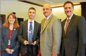  ?? SUBMITTED PHOTO ?? Shane McLaughlin, second from left, accepts the George M. Bratcher Award Oct. 3with, from left, Juvenile Probation Deputy Chief Diana Munson, Chief Don Corry, and Deputy Chief Jay Leamy.