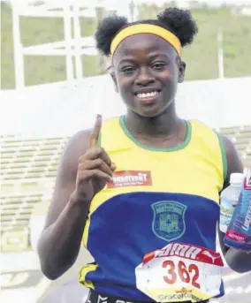  ?? (Photo: Dwayne Richards) ?? Lavanya Williams of Rusea’s High School celebrates winning the Class Three 100m final in 12.18 seconds on Thursday.