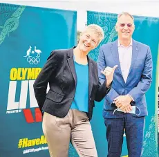  ?? — AFP photo ?? This file photo shows former Australian Olympian and Queensland Olympic Council president Natalie Cook (left) posing with chairman of the Australian Olympic Team Appeal Committee in Queensland, Mark Stockwell during an Olympics live announceme­nt in Brisbane.