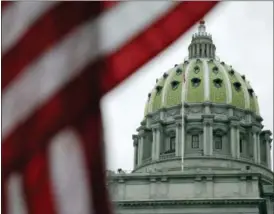  ?? AP PHOTO/PAUL SANCYA ?? This Wednesday, Oct. 7, 2015 file photo shows the Pennsylvan­ia Capitol building in Harrisburg, Pa. An Associated Press analysis, using a new statistica­l method of calculatin­g partisan advantage, finds traditiona­l battlegrou­nds such as Michigan, North Carolina, Pennsylvan­ia, Wisconsin, Florida and Virginia were among those with significan­t Republican advantages in their U.S. or state House races in 2016.