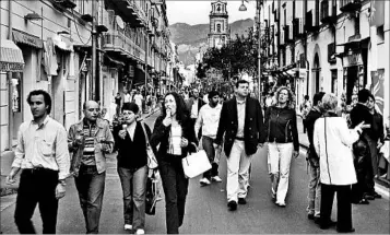  ?? RICK STEVES/RICK STEVES’ EUROPE ?? All of Sorrento turns out for the evening passeggiat­a, the town’s ritual promenade, to enjoy the fresh air.