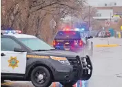  ?? JIM THOMPSON/JOURNAL ?? A police vehicle with a K-9 officer drives toward Rio Grande High School on Thursday while the campus is locked down after a fight and reports of a gun.