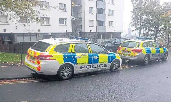  ??  ?? Police attending the scene of the attack at Tulloch Court.