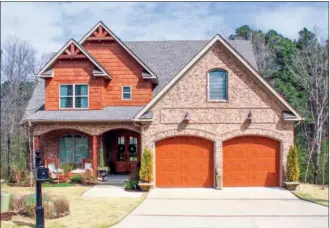  ?? LINDA GARNER-BUNCH/Arkansas Democrat-Gazette ?? This home, located at 104 Cove Creek Court in Little Rock, has about 3,301 square feet and is listed for $474,900 with Kelly Johnson of the Janet Jones Co. No open house is planned for today. For more informatio­n or to schedule a private showing, call...