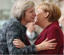  ??  ?? Phone call: Theresa May and Angela Merkel