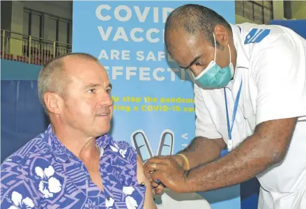  ?? Photo: Ronald Kumar ?? Australian High Commission­er to Fiji John Feakes gets his jab from staff Nurse
Ilaitia Cama at Vodafone Arena on April 15, 2021.