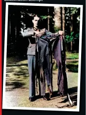  ?? ?? The adjutant holds up Hitler’s tattered trousers after the bomb blast. Later that day Hitler would proudly show deposed Italian dictator Benito Mussolini the same shredded clothes