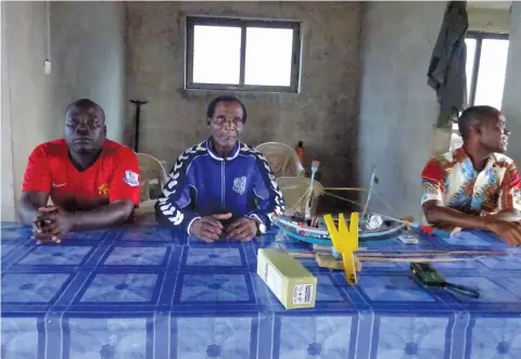  ??  ?? Nana Kobina Caique (centre), chief fisherman of Ghana's Apam fishing community says internatio­nal vessels, who bribe local officials, often escape after destroying the community's nets