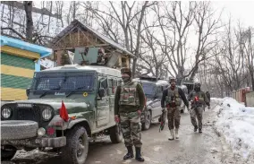  ?? — PTI ?? Army soldiers at Wani in Shopian district of south Kashmir during an encounter in which top three miltant commanders were killed on Monday.