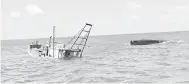  ??  ?? KARAM: Keadaan dua bot nelayan Vietnam yang karam dipercayai terkandas melanggar batu karang semasa menceroboh perairan negara.