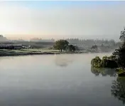  ?? PHOTO: PETER MEECHAM ?? The Waikato River bathed in early morning fog.