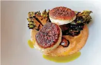  ?? [PHOTO BY BRYAN TERRY, THE OKLAHOMAN] ?? Patrono’s new menu includes seared diver scallops, which arrive to the table charred to perfection but still sweet and moist in the center.