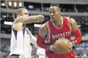  ?? TONY GUTIERREZ / ASSOCIATED PRESS ?? Houston Rockets center Dwight Howard, being guarded by Dallas’ Tyson Chandler, returned to the Rockets lineup after taking Wednesday’s win off. He had eight points.