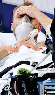  ??  ?? Denmark’s Christian Eriksen after receiving CPR on the pitch when his heart stopped during a Euros match yesterday