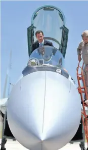  ?? — AFP ?? A picture released on the official Facebook page of the Syrian Presidency on Tuesday shows President Bashar al-Assad sitting inside a Sukhoi Su-27 to the Hmeimim military base in Latakia province, Syria.