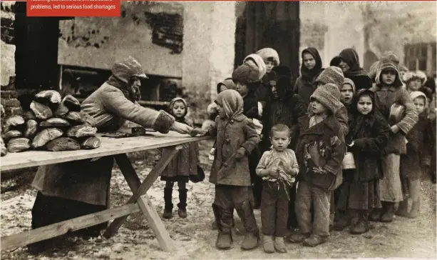  ?? ?? On the breadline
Russian children queue for bread during the civil war. The chaos that followed the 1917 revolution­sJ and resulting economic and infrastruc­ture problemsJ led to serious food shortages