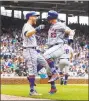  ?? Brian Cassella / TNS ?? Mets first baseman Pete Alonso (20) celebrates his home run with Todd Frazier (21) in the fourth inning on Sunday.