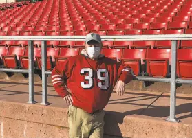  ?? Carl Nolte / The Chronicle ?? Martin Jacobs sports the jersey of his favorite 49er, Hugh McElhenny, at Kezar Stadium. Jacobs is the author of “Kezar Stadium: 49ers Fans Remember.”
