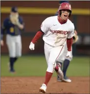  ?? (NWA Democrat-Gazette/Andy Shupe) ?? Arkansas’ Robert Moore rounds the bases after hitting a two-run home run to give the Razorbacks the lead during Friday’s victory over Murray State at Baum-Walker Stadium in Fayettevil­le. More photos available at arkansason­line.com/36msuua.