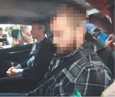  ?? Picture: AAP ?? Bobby Andrew Weaver is driven from Tweed Heads Police Station yesterday. He has been charged with the murder of David Thornton (below) after a body was found in Mr Thornton’s Goodna backyard.