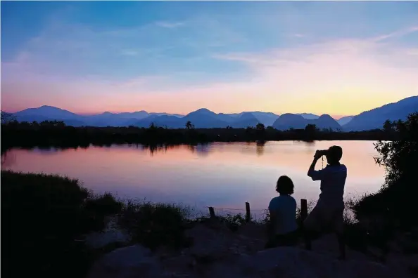  ??  ?? Tranquilit­y at the ex-mining pool at Malim Nawar. — Photos: YOON LAI WAN