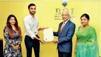  ?? ?? From right: BOI Chairman Raja Edirisuriy­a and Director General Renuka M. Weerakone with KSPA Directors Saveen Abeyratne and Sonali Abeyratne at the occasion of signing the agreement