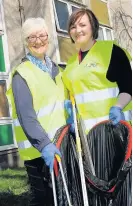  ??  ?? Careful project Councillor Natalie Don on a litter pick with Councillor Cathy McEwan