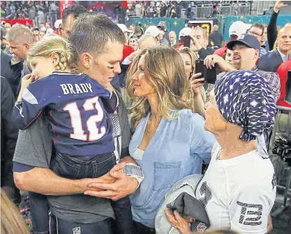  ??  ?? New England’s Tom Brady celebrates with wife Gisele Bundchen and daughter Vivian Brady after winning the Super Bowl.