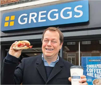  ?? ?? Tucking in: Tom Parker Bowles with a Greggs’ bacon roll and coffee
