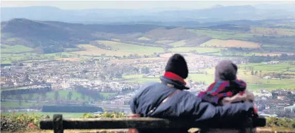  ??  ?? > ‘Stunning scenery and sophistica­tion’ – looking over the town of Monmouth, Monmouthsh­ire, from The Kymin