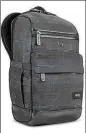  ?? SOLO ?? The Solo Boyd backpack has a padded fabric panel you can slide over your roller bag for a safe trip through airports.