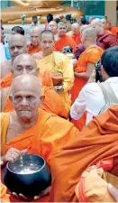  ??  ?? THE SCENE IN LANKA LAST WEEK: The new trend of the Moneypura monk brigade, some even escorted by cheerleade­r women demanding the public to give money to the monks