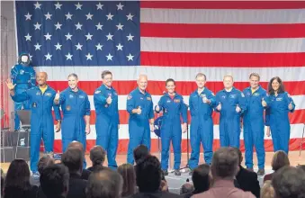  ?? DAVID J. PHILIP/ASSOCIATED PRESS ?? The nine astronauts selected are, from left, Victor Glover, Michael Hopkins, Robert Behnken, Douglas Hurley, Nicole Mann, Christophe­r Ferguson, Eric Boe, Josh Cassada and Sunita Williams.