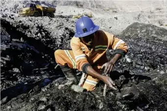  ??  ?? A miner at Kagems emerald mine in Lufwanyama