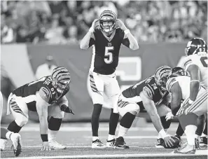  ?? ALBERT CESARE/ USA TODAY SPORTS ?? Bengals quarterbac­k Ryan Finley prepares to hike the ball in the third quarter of a preseason game against the Giants.