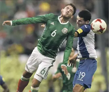  ?? Pedro Pardo AFP/Getty Images ?? MIDFIELDER Jonathan dos Santos, left, could make his MLS debut next week, joining older brother Gio.