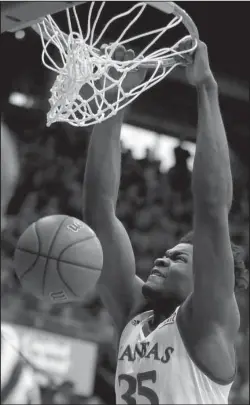  ?? The Associated Press ?? RIM RATTLER: Kansas’ Udoka Azubuike dunks the ball during the first half of an 89-74 victory over Stanford, the Jayhawks’ 44th consecutiv­e win at Allen Fieldhouse in Lawrence, Kan.