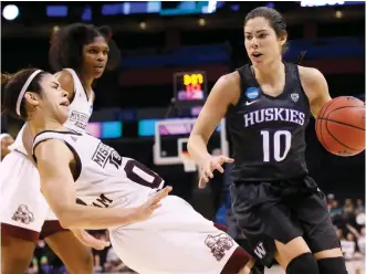  ?? (Photo by Sue Ogrocki, AP) ?? Mississipp­i State senior guard Dominique Dillingham, left, reacts to contact from Washington guard Kelsey Plum (10) on Friday night in Oklahoma City.