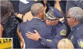  ?? SUSAN WALSH/ASSOCIATED PRESS ?? President Obama hugs Dallas Police Chief David Brown at the end of a memorial service for the fallen police officers and members of the Dallas community at the Morton H. Meyerson Symphony Center in Dallas on July 12, 2016. Obama praised law enforcemen­t...