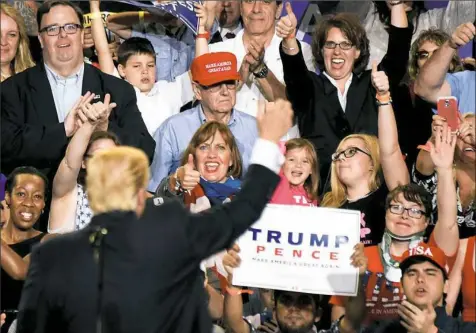  ?? Haley Nelson/Post-Gazette photos ?? President Donald Trump gives a thumbs up to his supporters on Saturday at the Pennsylvan­ia Farm Show Complex and Expo Center in Harrisburg. For additional photos, visit post-gazette.com.