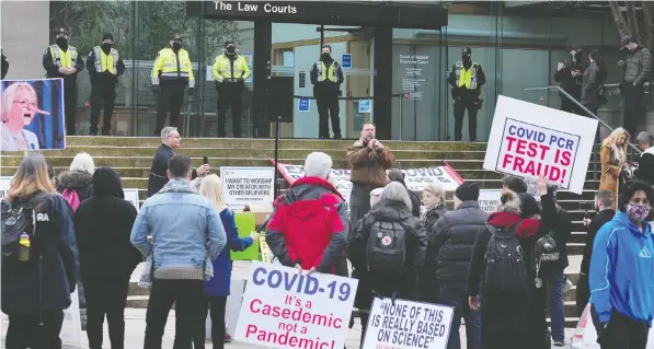  ?? NICK PROCAYLO ?? Protesters gather outside B.C. Supreme Court as a legal advocacy group challengin­g COVID-19 restrictio­ns on worship services is heard in court. The judge hearing the case questioned why the province's top doctor, Dr. Bonnie Henry, has not filed an affidavit.