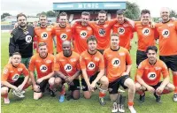  ??  ?? ●● The teams pose for the cameras before the kick-off of the charity match