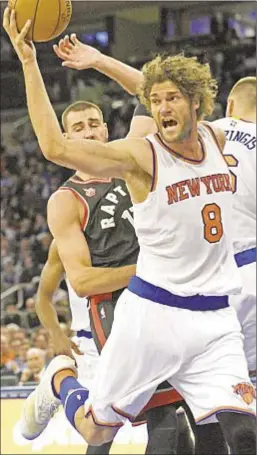  ?? PHOTO BY AP ?? Knicks center Robin Lopez, much like his teammates, has nowhere to go in blowout loss to the Raptors in the Garden.