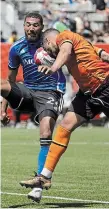  ?? NICK IWANYSHYN THE CANADIAN PRESS ?? Forge FC forward Jordan Hamilton, right, battles for the ball with CF Montreal defender George Campbell during second half Canadian Championsh­ip soccer action on Tuesday.