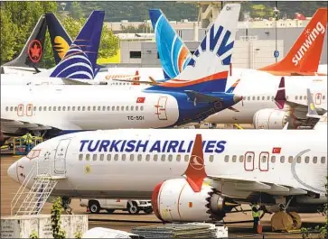  ?? David Ryder Getty Images ?? BOEING 737 Max jets at Boeing Field in Seattle. A high-ranking company pilot working on the plane three years ago during its certificat­ion expressed misgivings about a feature since implicated in two fatal crashes.