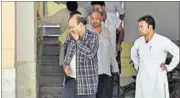  ?? HT FILE ?? BK Bansal (in check shirt) was granted bail to perform the last rites of his wife and daughter who committed suicide in July.