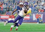  ?? [AP PHOTO] ?? Minnesota wide receiver Adam Thielen fails to catch a pass in front of New England’s Devin McCourty during Sunday’s game in Foxborough, Mass.