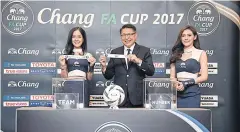  ??  ?? FAT secretary-general Pisan Jundilok takes part in the FA Cup draw yesterday.