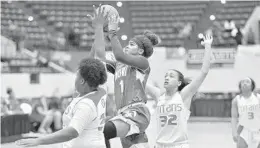  ?? MICHAEL LAUGHLIN/SUN SENTINEL ?? Nova's Gabrielle Gonzalez scores over Tampa Bay Tech during the second half of their 8A state semifinal game, Friday, March 2, 2018, at Lakeland's RP Funding Center.